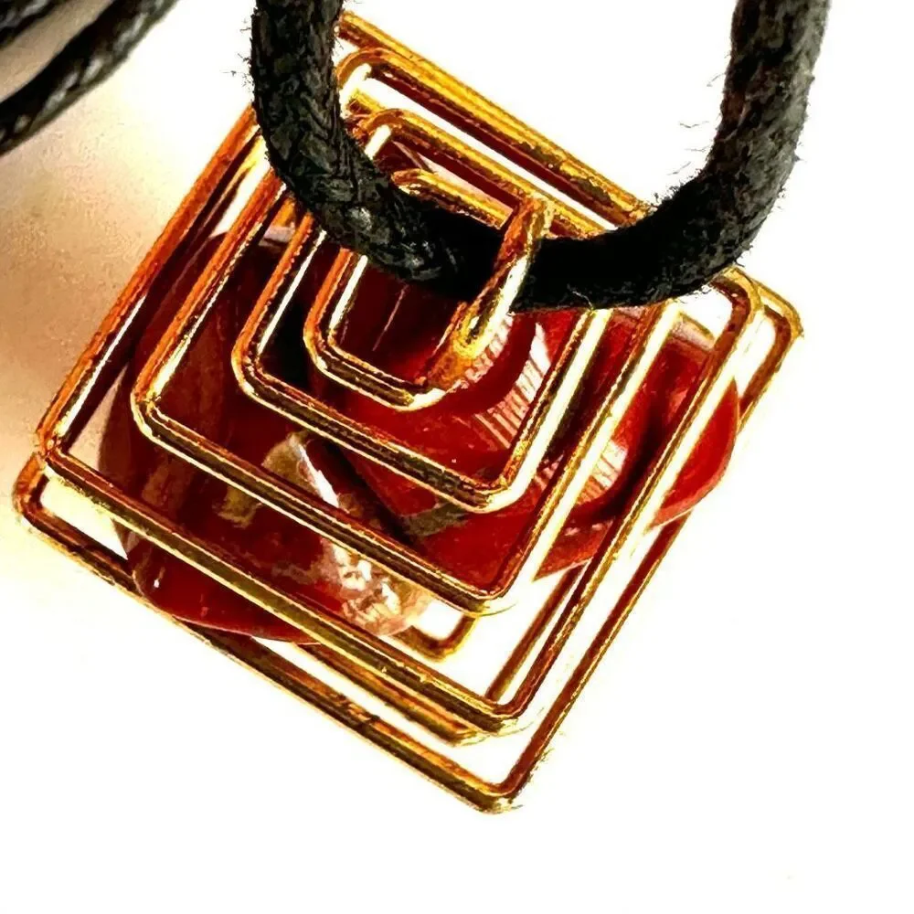 Red jasper gold tone caged pendant necklace